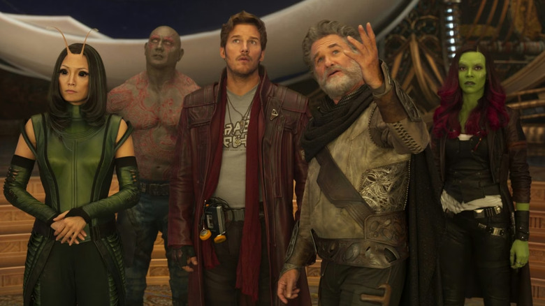 Mantis (Pom Klementeiff), Drax (Dave Bautista), Star-Lord (Chris Pratt), and Gamora (Zoe Saldaña) look up as Ego (Kurt Russell) visualizes his past in Guardians of the Galaxy Vol. 2