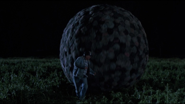 The giant critter ball rolling through a field in Critters 2: The Main Course