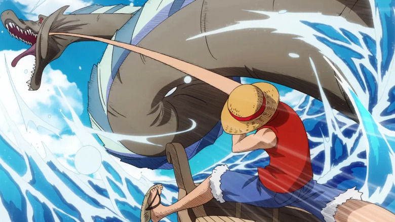 Luffy punching a Sea King in the face with his fist in One Piece