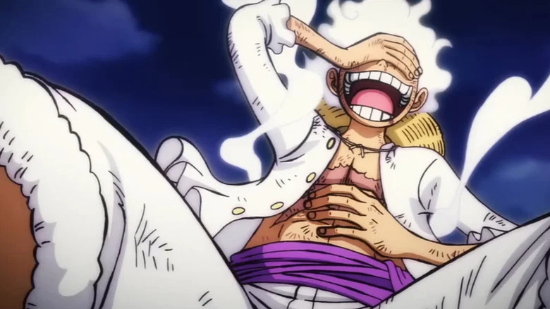 Luffy in Gear 5 form laughing wildly in One Piece