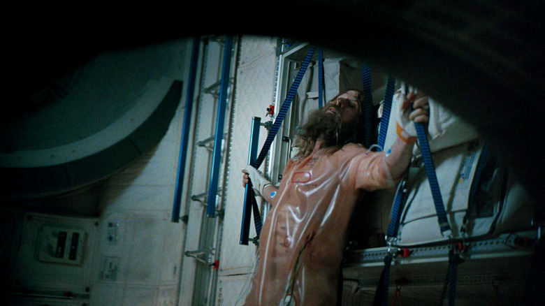 Ryland Grace (Ryan Gosling) clings to a wall in Project Hail Mary