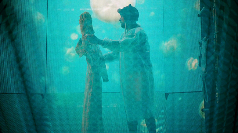 Ryland Grace (Ryan Gosling) dances with a mop dressed like a beautiful lady in Project Hail Mary