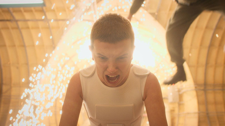 Millie Bobby Brown as Eleven wearing a white vest in Stranger Things season 4