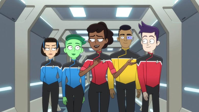 The central cast of Star Trek: Lower Decks, walking abreast down a hallway