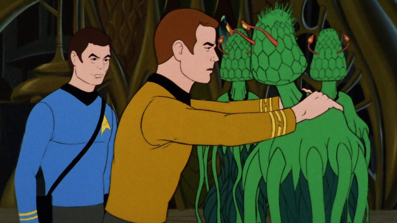 Dr. McCoy looking at Kirk as he greets a plant-like Phylosian on Star Trek: The Animated Series