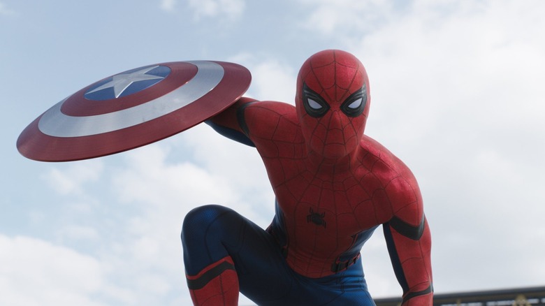 Spider-Man holding Captain America's shield in Captain America: Civil War