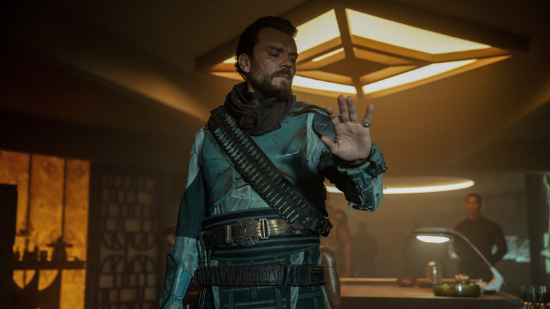 Pilou Asbæk's The Mule looking at his hand on Foundation