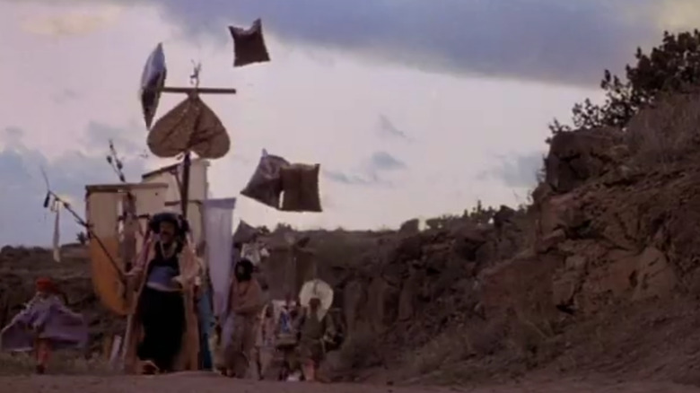 A caravan is walking in the wilderness in Nightfall