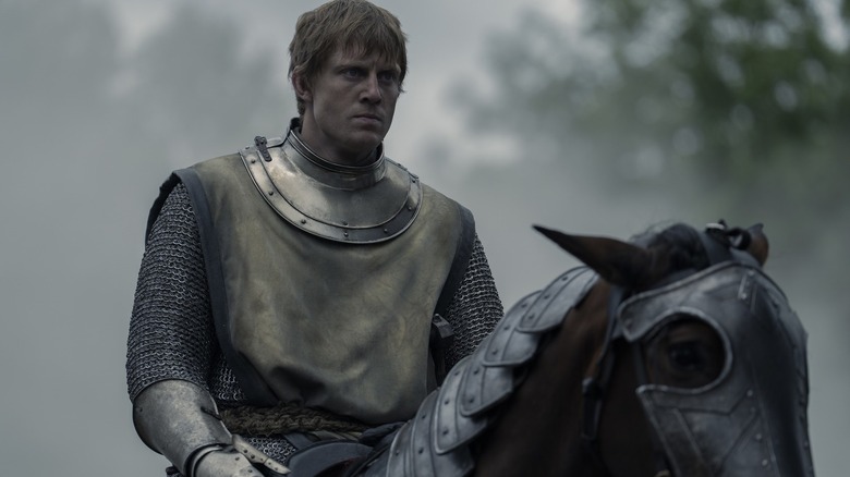 Ser Duncan (Peter Claffey) sits on an armored horse in A Knight of the Seven Kingdoms