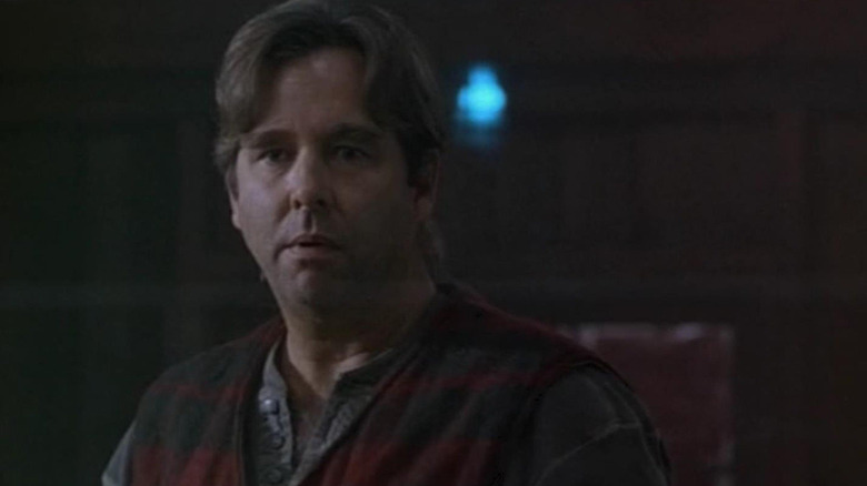 Simon Kress (Beau Bridges) sits stunned in The Outer Limits (1995)