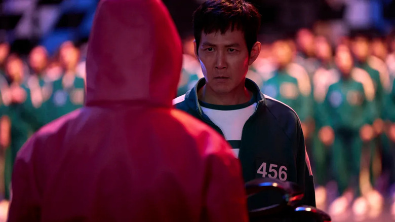 Gi-hun faces a guard in Squid Game season 2
