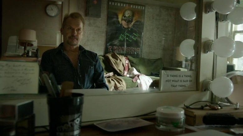Michael Keaton's Riggan Thompson looks in the mirror in Birdman