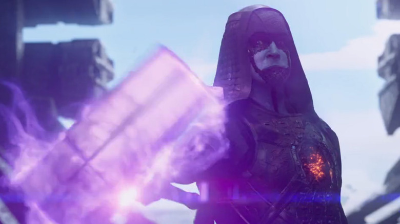 Lee Pace as Ronan The Accuser in Guardians of the Galaxy holding hammer infused with Power Stonee