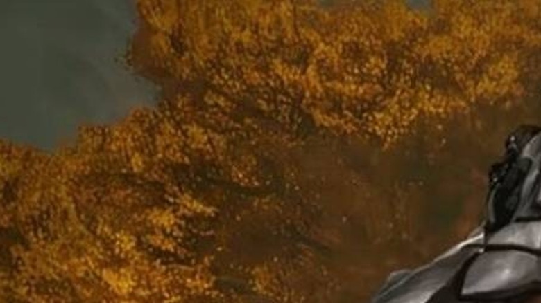 Yautja holding Kenji (Louis Ozawa Changchien) by the throat in Predator: Killer of Killers