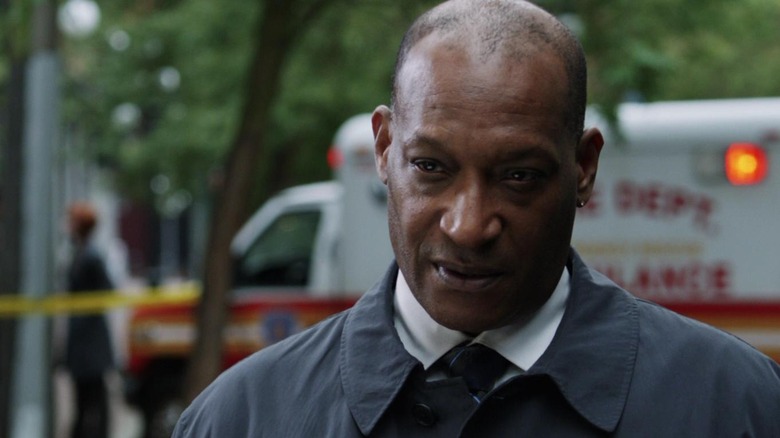 Tony Todd as William Bludworth in front of an ambulance in Final Destination 5