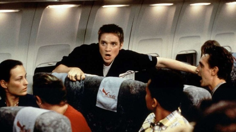 Devon Sawa as Alex panicking on the flight in Final Destination