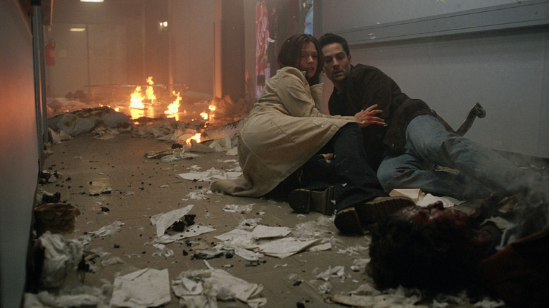 A.J. Cook as Kimberly Corman and Michael Landes as Thomas in the flaming wreckage in the hallway at the hospital in Final Destination 2