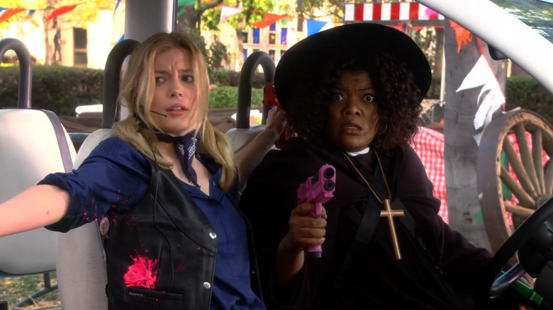 Britta and Shirley looking alarmed while dressed in Western costumes in Community