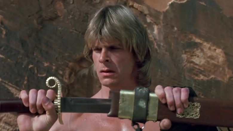 The Beastmaster holding a weapon