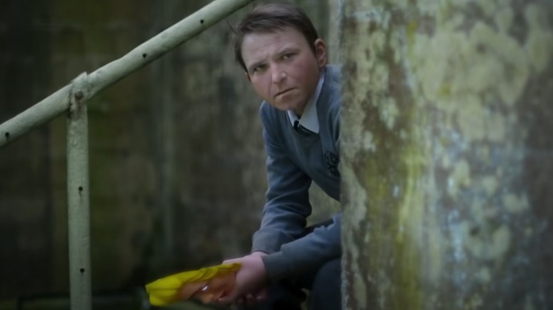 Creepy man-faced boy Samuel in Men