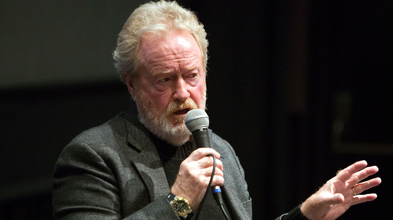 Ridley Scott talking into a microphone
