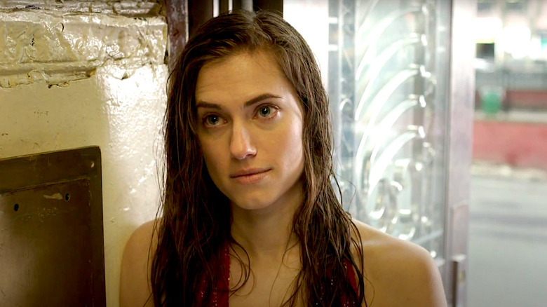 Allison Williams stands in a stairwell in Girls