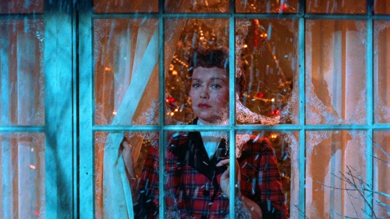 woman looking out the window