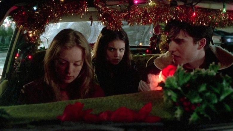 Three people sitting in a car