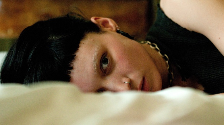 Rooney Mara lying on bed