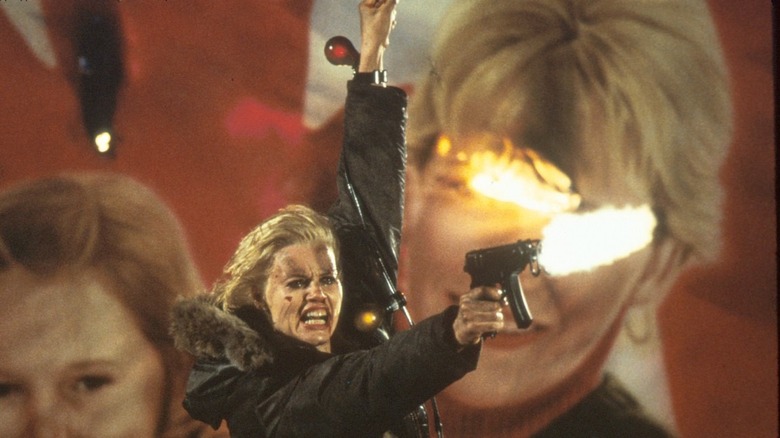 Geena Davis firing a gun