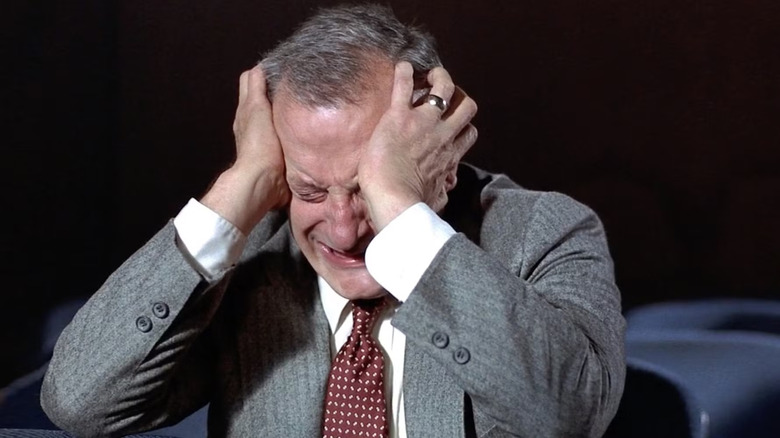 George C Scott as Jack VanDorn with his head buried in his hands in Hardcore