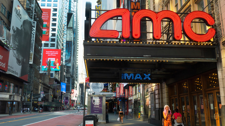amc movie theatre marquee on a busy manhattan street