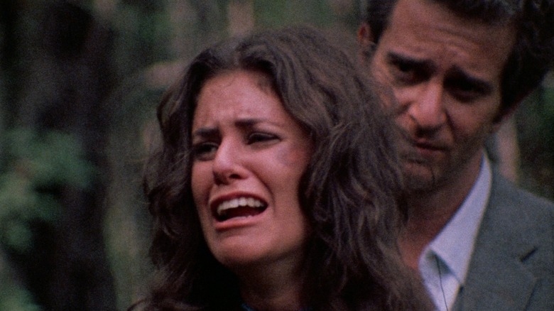 Woman screaming in front of man in Last House On The Left