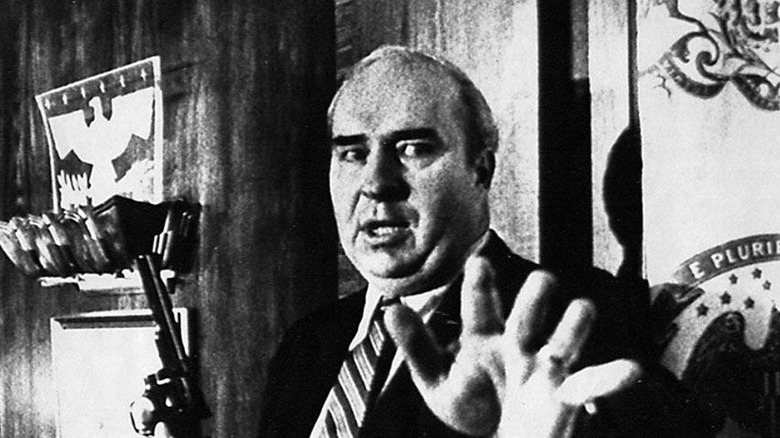 Budd Dwyer holding gun in black and white