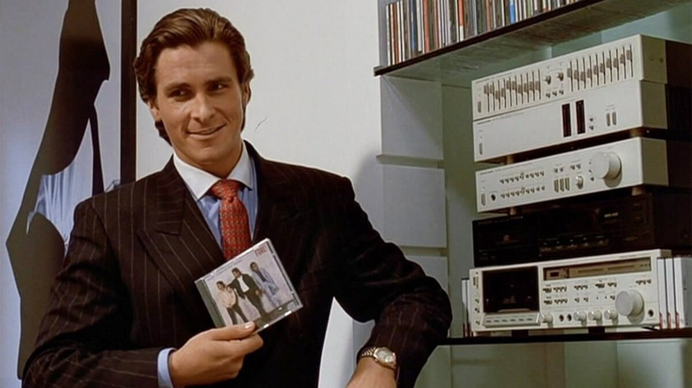 Patrick Bateman holding a Huey Lewis and the News CD in American Psycho
