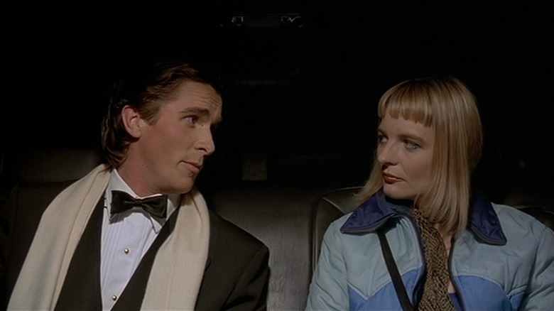 Patrick Bateman with woman in American Psycho