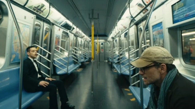 Elliott talks to Mr. Robot in a subway train
