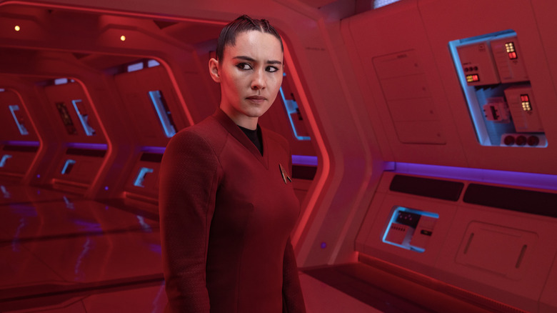 Christina Chong frowns and looks to the side as La'an in Star Trek: Strange New Worlds