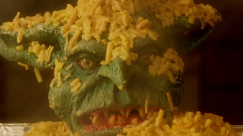 The Cheddar Goblin covered in mac and cheese in Mandy