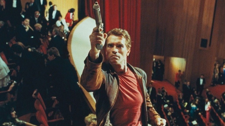Jack Slater takes aim in a theater in Last Action Hero