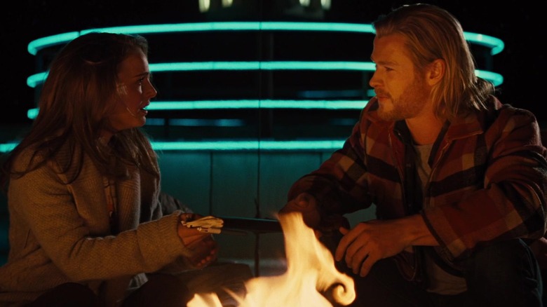 Jin Foster (Natalie Portman) listens to the Thurcates (Chris Hemsworth) Explanation of Magic in Thor (2011)