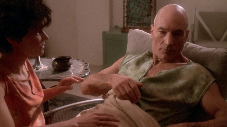 Picard waking up in bed in a tank top, a woman next to him, on Star Trek: The Next Generation
