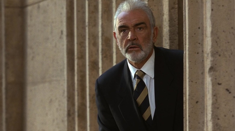Sean Connery's John Patrick Mason peeks out from behind a cement column in The Rock