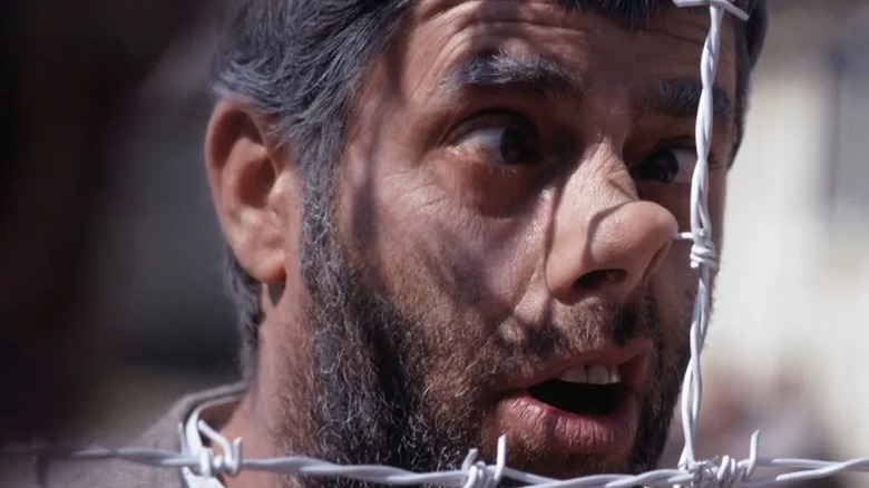 Jerry Lewis gets his nose stuck on barbed wire as Helmut Doork in The Day the Clown Cried in From Darkness to Light