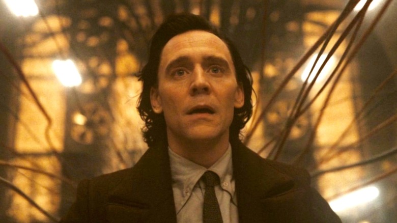 Loki impaled by timeline threads with a look of shock on his face in Loki