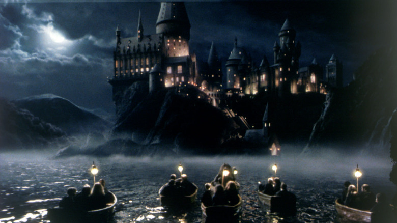 Boats of first years riding to Hogwarts in Harry Potter and the Sorcerer's Stone