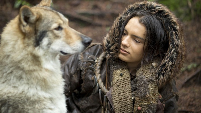 Kody Smit-McPhee as Keda looking at Alpha the wolf in Alpha