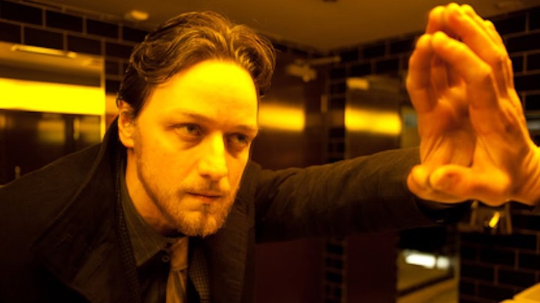 Bruce Robertson staring into a mirror in Filth