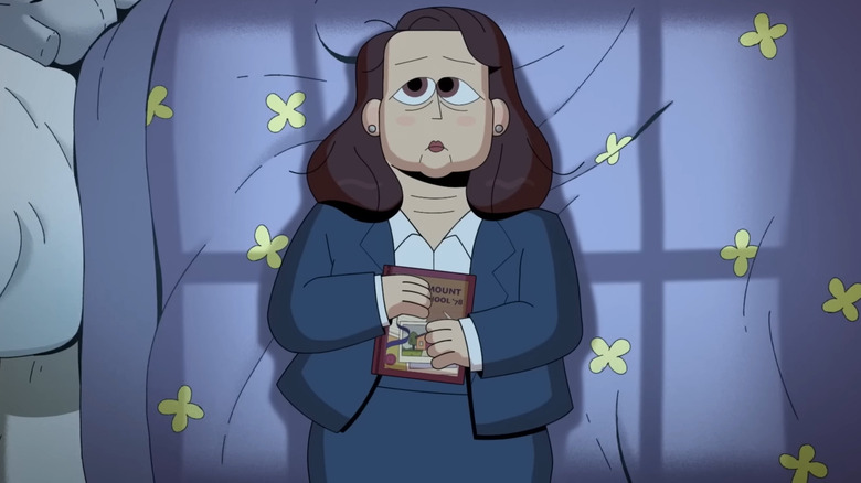 Carol laying in bed holding a book in Carol & The End of the World