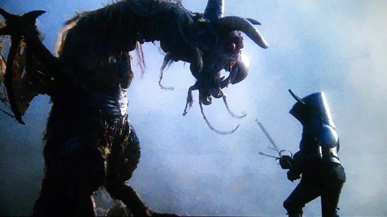 Michael Palin as Dennis Cooper does battle with a winged monster in Jabberwocky